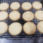 Golden traditional Scottish shortbread cookies cooling on wire rack