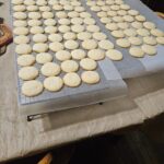 Soft lemon cookies drizzled with sweet lemon glaze cooling on rack]