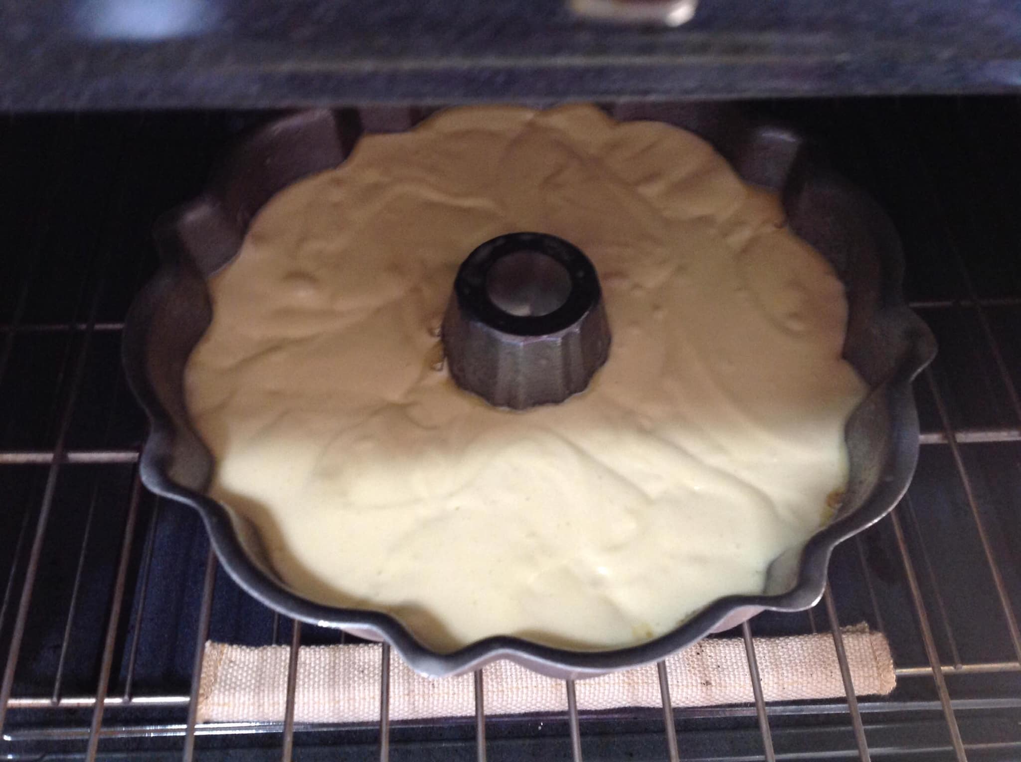 Pineapple upside down Bundt cake baking in oven