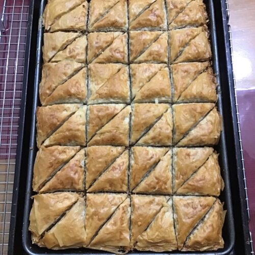 Pan of golden baked baklava fresh from the oven
