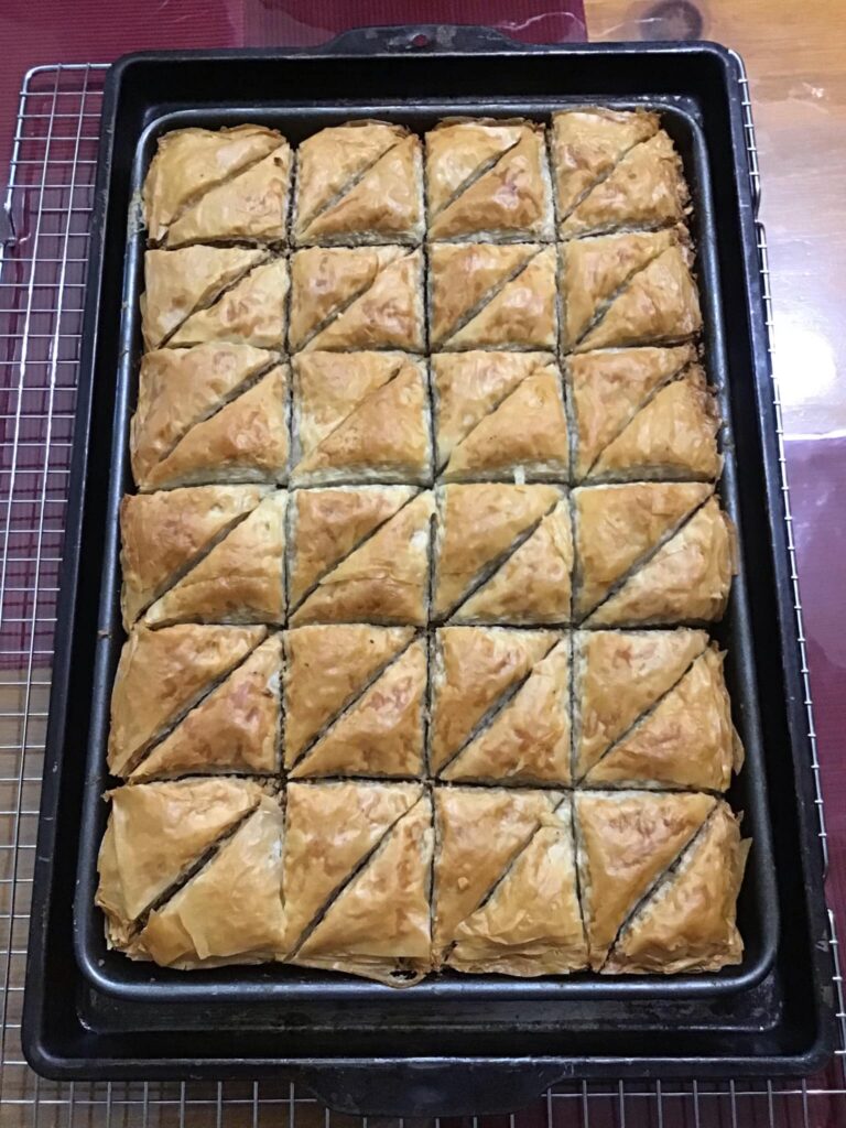 Pan of golden baked baklava fresh from the oven
