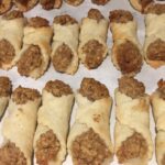 Hungarian cold dough nut cookies cooling on parchment after baking