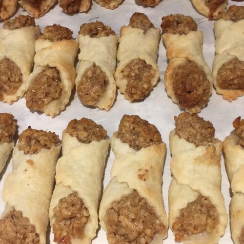 Hungarian cold dough nut cookies cooling on parchment after baking