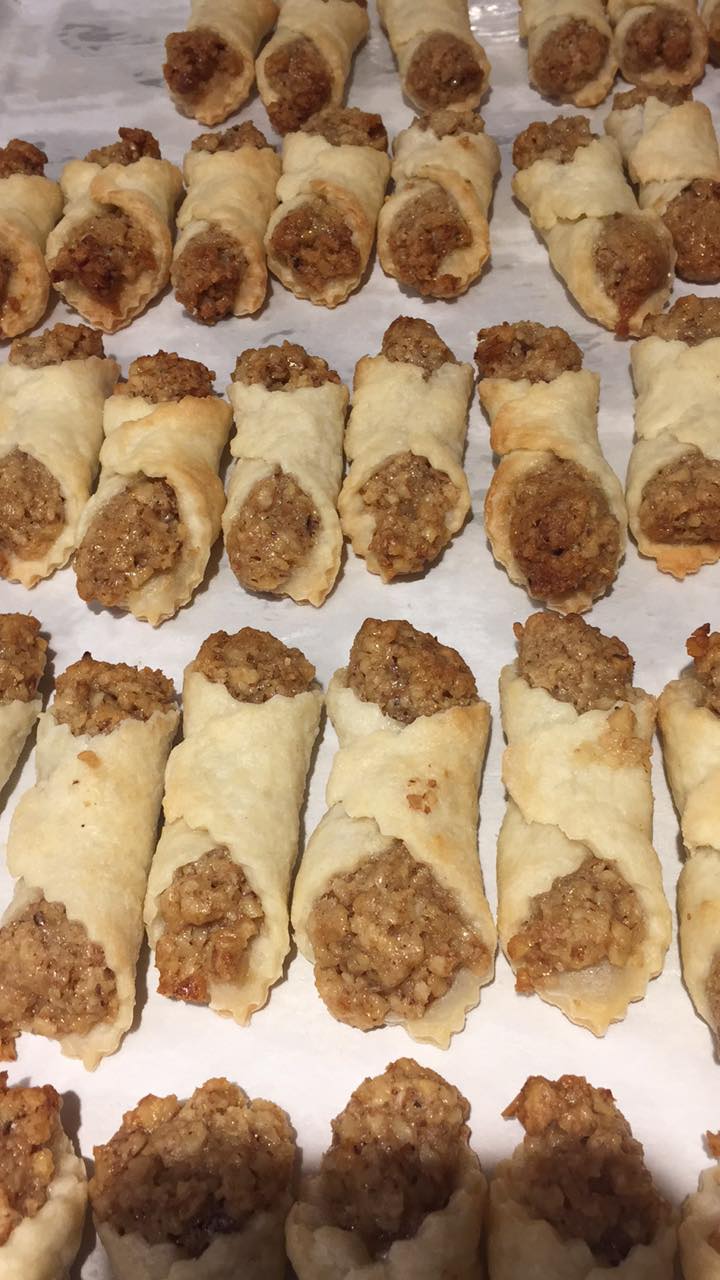 Hungarian cold dough nut cookies cooling on parchment after baking