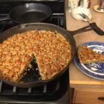 Southern cast iron pecan tart baked in 12-inch skillet with golden pecans and flaky crust
