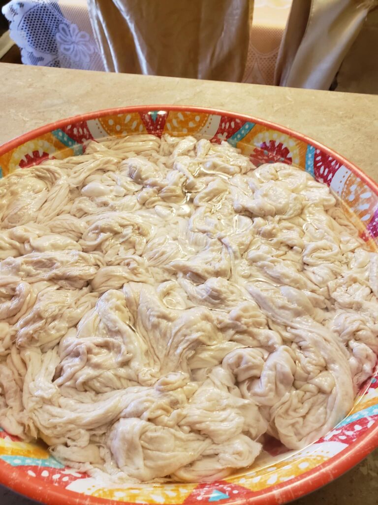 cleaned chitterlings in a colorful bowl soaking in water