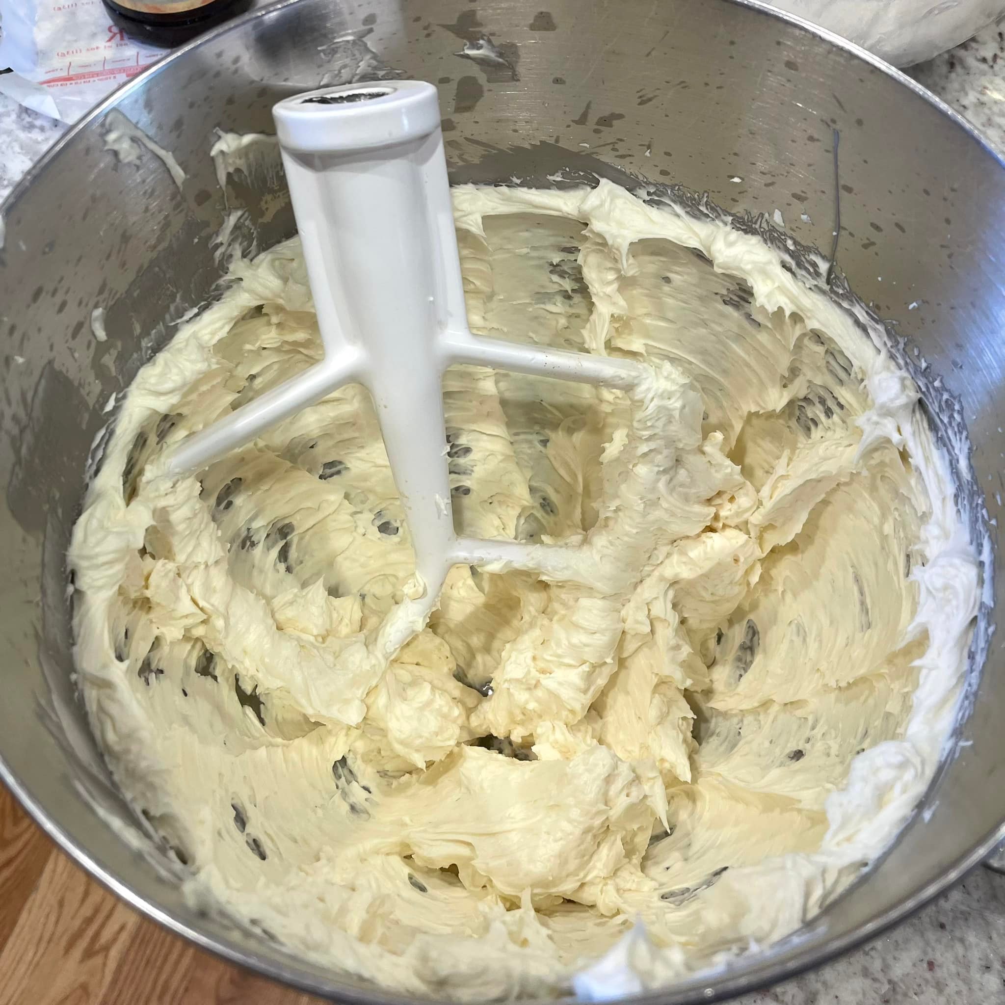 mixing bowl filled with light, fluffy Ermine frosting after whipping