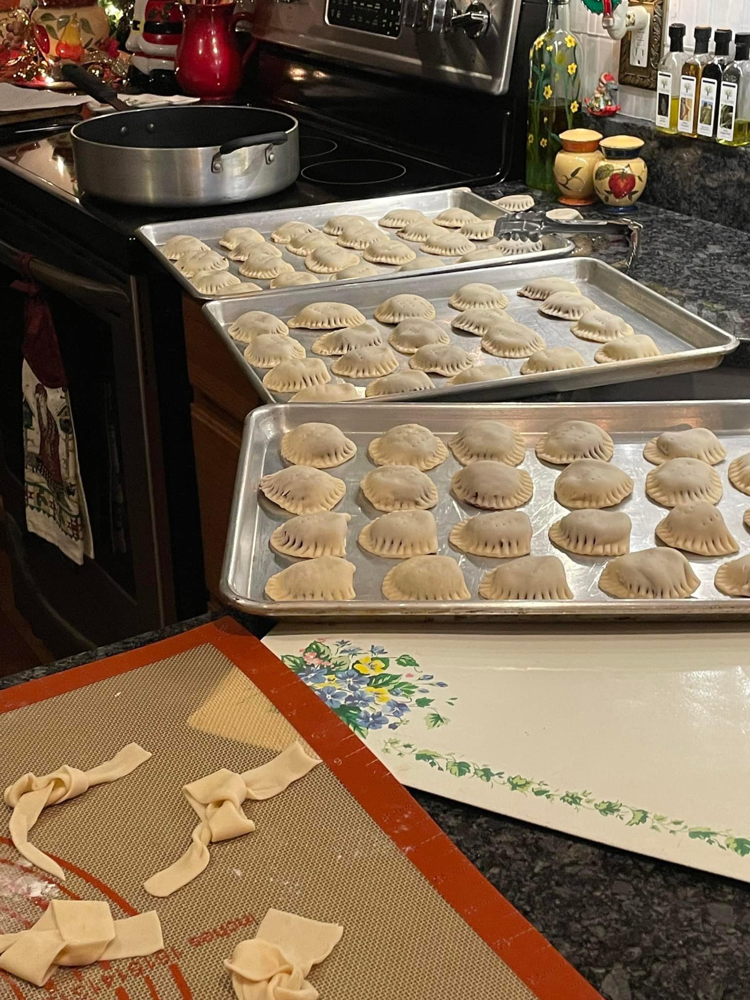 hands filling and sealing Italian chickpea fritters before frying]
