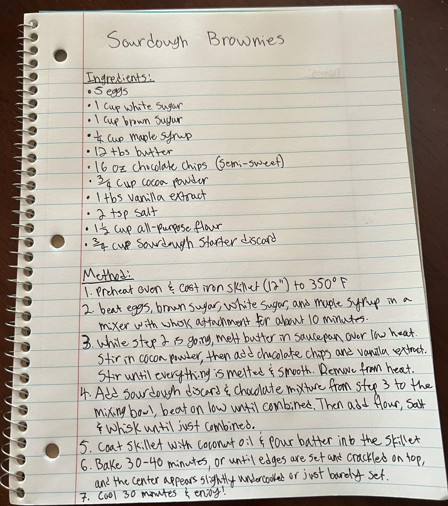 handwritten sourdough discard brownie recipe in a notebook
