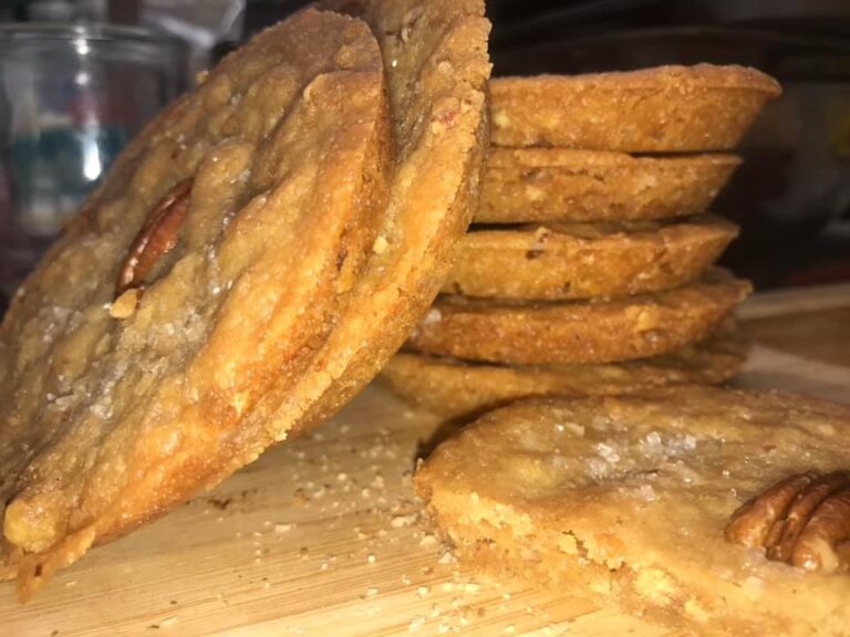 stack of old fashioned butter pecan shortbread cookies with pecan halves and sanding sugar]