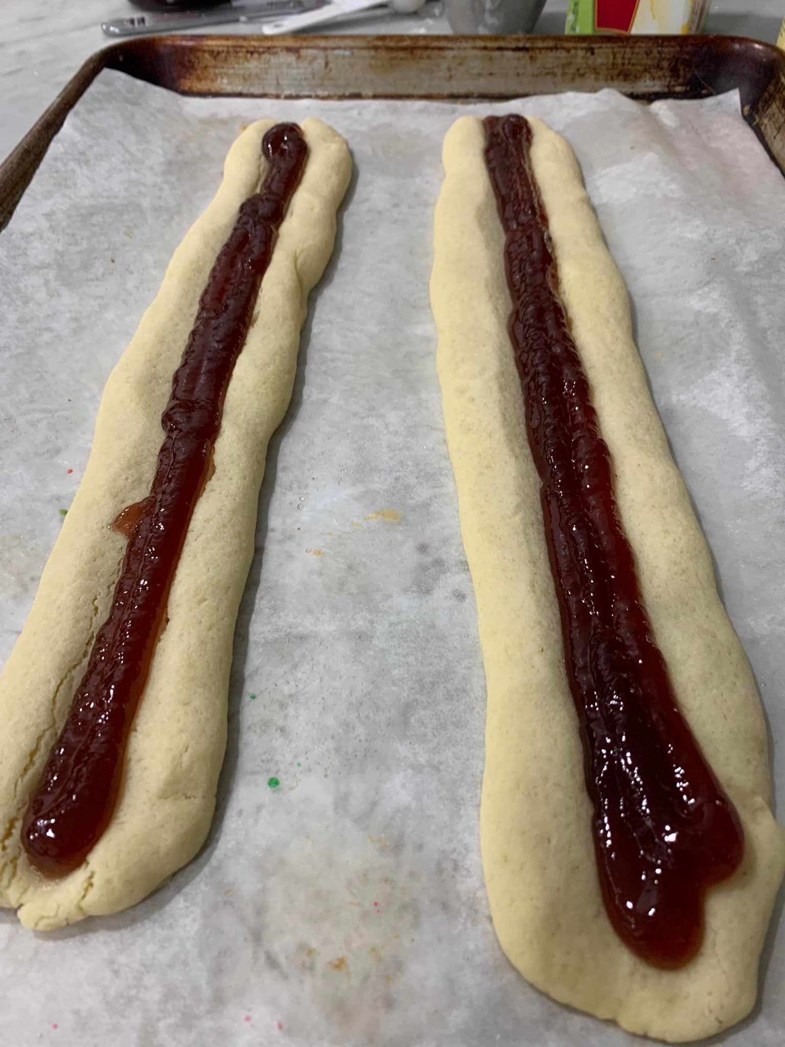 Cookie dough log with a perfect indentation down the center ready for baking.