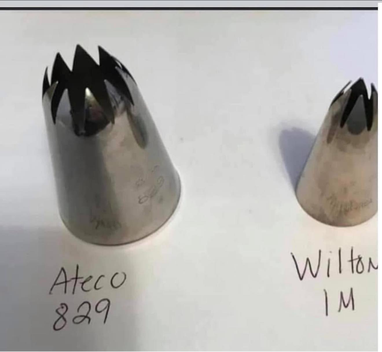 Comparison of piping tips showing the large Ateco 829 next to a Wilton 1M tip