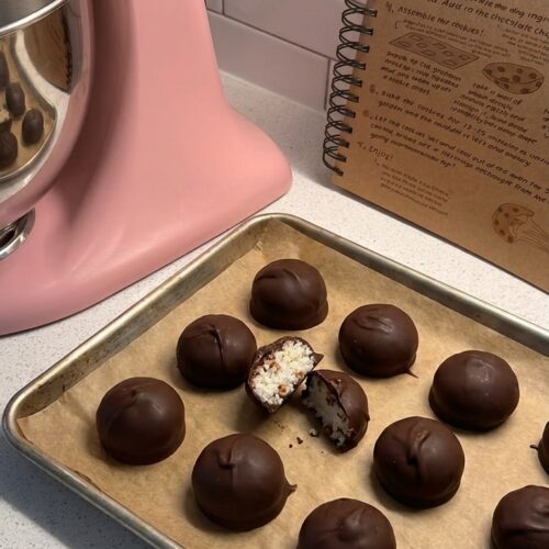 Homemade Martha Washington Candies with dark chocolate coating and sweet coconut pecan filling, arranged on a Christmas candy platter.